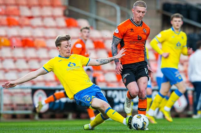 Raith Rovers' Kyle Turner tackling Dundee United's Craig Sibbald during the Fifers' 2-0 Scottish Championship away defeat at Tannadice Park on Saturday (Photo by Ewan Bootman/SNS Group)