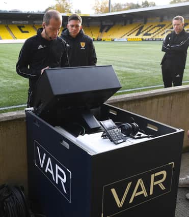 Referee Willie Collum testing a VAR screen before Livingston and Celtic's match on Saturday (Photo by Craig Foy/SNS Group)