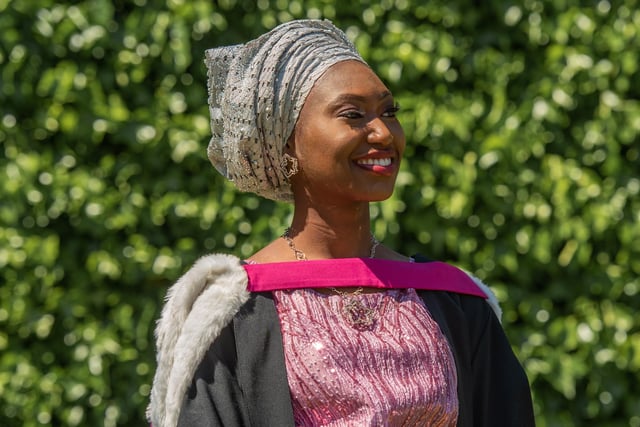 Pictured in Nigerian national dress is Oiza Apeji, who graduated with a degree in Economics and Maths.
