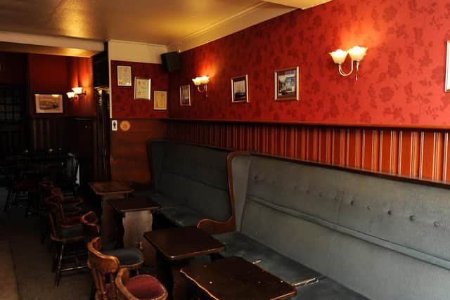 Jon intends to replace the red decor with a dark mustard colour as part of the makeover. Pic: Fife Photo Agency