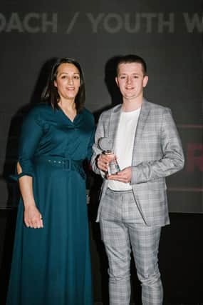 Ewan McTurk with his Coach of the Year award