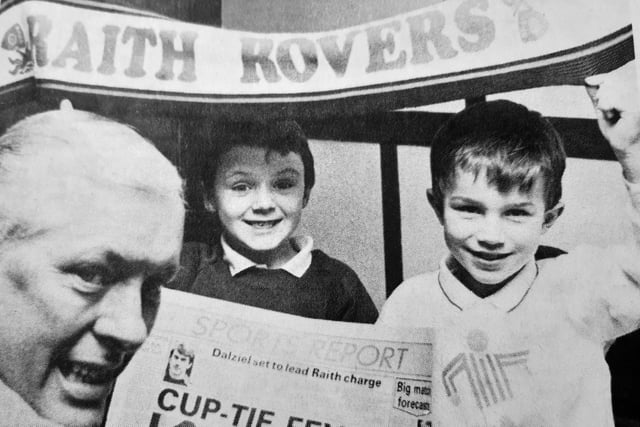 Cup fever hit Kirkcaldy.
Raith Rovers’ big Scottish Cup tie against Rangers brought the big-time atmosphere back to Stark’s Park.
Counting down to the gamer are manager Frank Connor and young mascots Kenneth Rankin and Grant Fraser, both aged six.