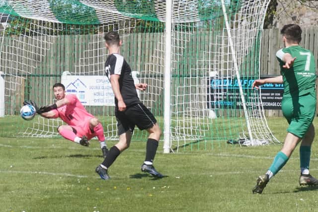 Dalkeith Thistle goalkeeper Jamie Newman saves an effort from Thornton Hibs' Murray Black
