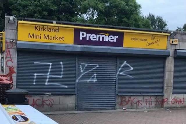 The vandal had also put racist slurs on the shop.