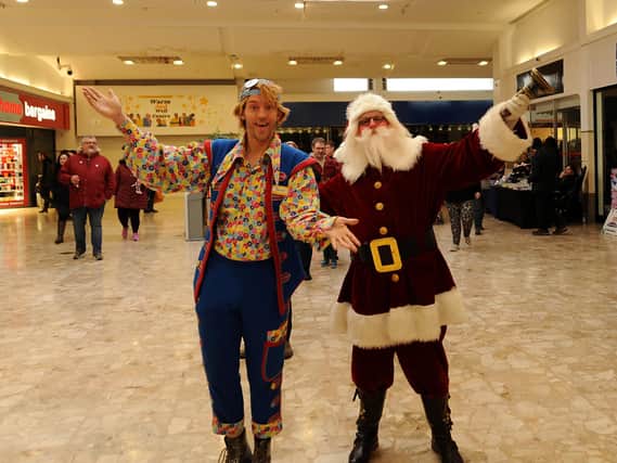 Buttons & Santa were in town on Saturday to turn on the Mercat Shopping Centre's Christmas tree lights.  (Pic: Fife Photo Agency)