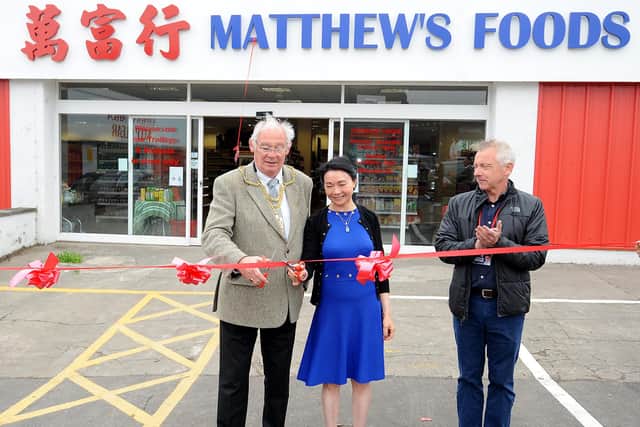 Fife Provost Jim Leishman cuts the ribbon with owner Amy Ng to officially open Matthew's Foods Oriental Supermarket. Pic: Fife Photo Agency