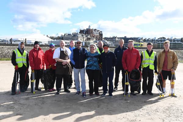 Musicians Huey Lewis and Tico Torres with chief litter pickers Daphne Billouri-Grant at the West Beach ahead of The Alfred Dunhill Links Championship at The Old Course.