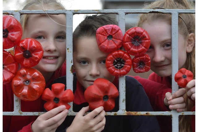 In 2018, Pitteuchar East Primary School created a poppy remembrance wall outside the school. All 300 children made a  poppy each and fixed them to the railings.
Pictured (from left) are  Carly Curtis, Daniel Goodwin, Sofia Anderson