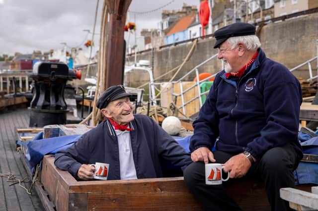 Scottish Fisheries Museum’s iconic ‘Fifie’ the Reaper
95 year old Coull Deas MBE, former long-time skipper, and Boat Club volunteer Jim Wilson, take a break after working on the £1million conservation of the Scottish Fisheries Museum’s iconic ‘Fifie’ Reaper,
© Martin Shields