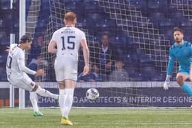 Ross County's Yan Dhanda converts his 53rd-minute penalty - awarded after a VAR check - past Raith Rovers goalkeeper Kevin Dabrowski (Pic by Mark Scates/SNS Group)