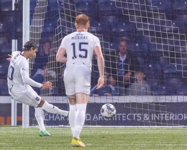 Ross County's Yan Dhanda converts his 53rd-minute penalty - awarded after a VAR check - past Raith Rovers goalkeeper Kevin Dabrowski (Pic by Mark Scates/SNS Group)