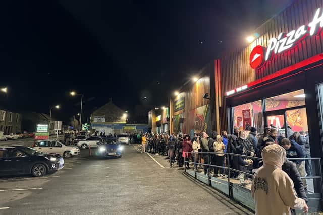 People queued last Wednesday outside Pizza Hut on Kirkcaldy's St Clair Street to get a £1 pizza while supporting the Cottage Family Centre.  (Pic: Pizza Hut Kirkcaldy)