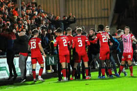 Raith players and fans celebrate the late equaliser. (Pic: Fife Photo Agency)