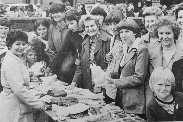 Sinclairtown Parish Church in Kirkcaldy held a jubilee garden fete in the church grounds.
Pictured are some of the customers at the soft goods stall.