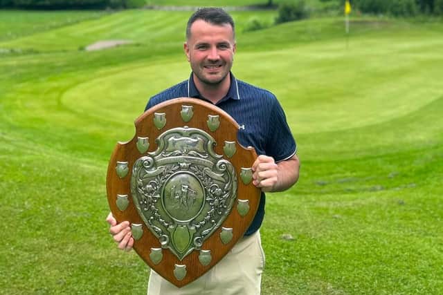 Jack Walsh holds aloft Kirkcaldy club championship trophy