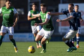 Hibernian's Kevin Nisbet and Raith Rovers' Liam Dick in action during Iain Davidson's testimonial match at Starks Park in Kirkcaldy in July 2021 (Photo by Ross MacDonald/SNS Group)