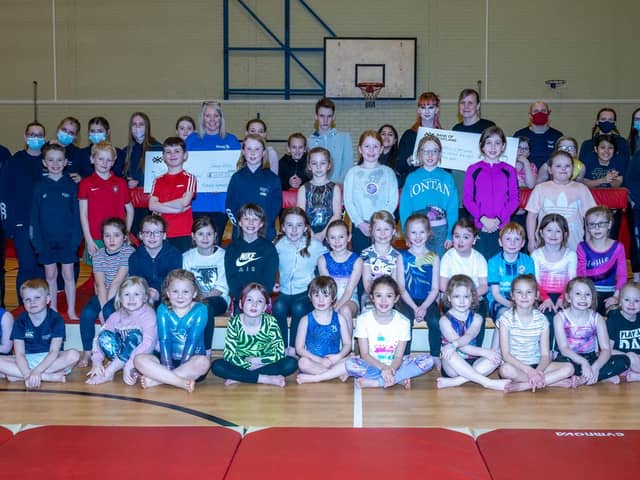 Members of Kirkcaldy Gymnastics Club have given two worthy causes a cash boost. Pic: John S Pow Photography.