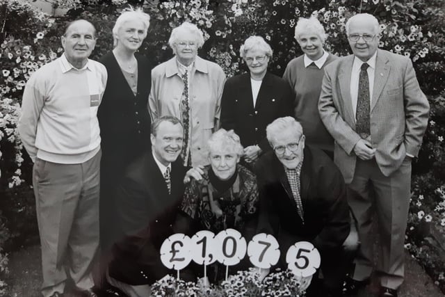 A garden fundraiser in Glenrothes in 1998. The picture caption says it was in the garden of Ella and John Kinnear who are pictured in the front row with Bob Fowler, fundraiser with MacMillan Cancer Relief. Standing (from left) are Alec Forret, Mrs Annie King, Miss Marjory Nuthal, Mrs Moira Anthony, Miss Avril Heggie and Bob Stewart.Picture from the Glenrothes Gazette archives.