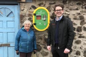Marilyn Edwards of the Craigencalt Rural Community Trust and Tom Antram, Communications Consultant at Fife Ethylene Plant with the defibrillator at Kinghorn Loch.