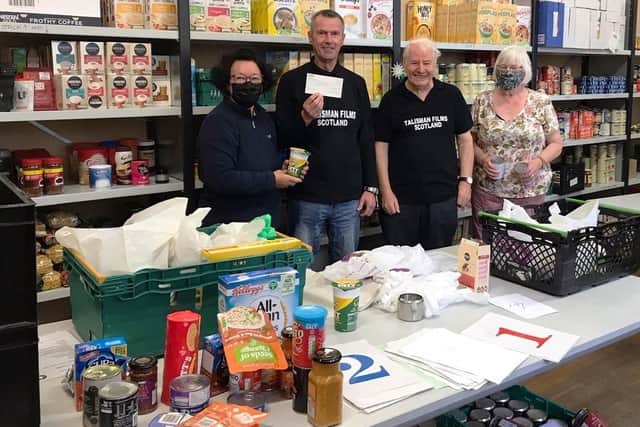 Val McDermid has donated her fee from narrating a new film about Kirkcaldy to Kirkcaldy Foodbank. Pictured are two volunteers with Robert Pratt treasurer and Bill Gourlay secretary from Talisman Films Scotland.