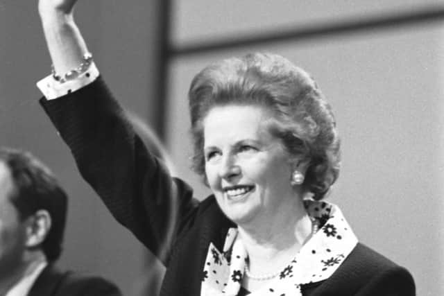 Prime Minister Margaret Thatcher waves to the audience at the Scottish Conservative Party conference in Aberdeen in May 1990.