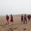 The players arriving on West Sands.