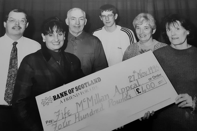 A cheque presentation to the Fife MacMillan Appeal in 1996. It was made at Warout Stadium in Glenrothes, and pictured are Sandy Thomson, secretary Kingdom Caledonian Amateur Football League;  Carol Sinclair from MacMillan, John Robertson, chairman Glenrothes Juniors; Sean Milne, Alison Harris and Sheila Milne.