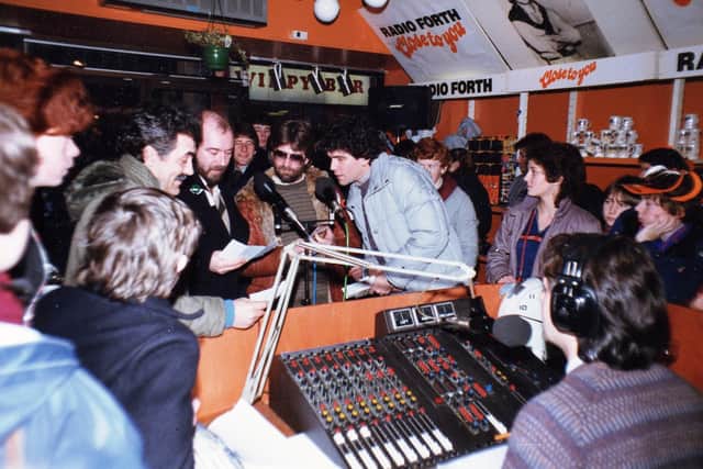 Nazareth pictured in the old Radio Forth Shop in High Street, Kirkcaldy, with DJ, Jay Crawford