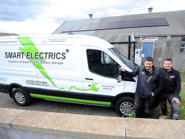 Burntisland - Fife - 
 Smart Electrics - Willie & Brian Smart with EV, powered by the Solar panels on the roof of their workshop 
credit- Fife Photo Agency