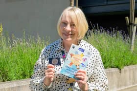 Donna Dewar, Cultural Services Assistant, with the Challenge’s Reading Trail and Reading Tracker | Pic: OnFife