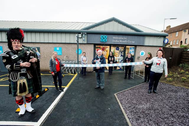 -Op re-opening Dollar Road, Burntisland, Fife. Piper Jim Forbes plays  as customer Peter George cuts the ribbon held by Store manager Tina Boles (right) and Briony Johnstone (Pic: Chris Watt)