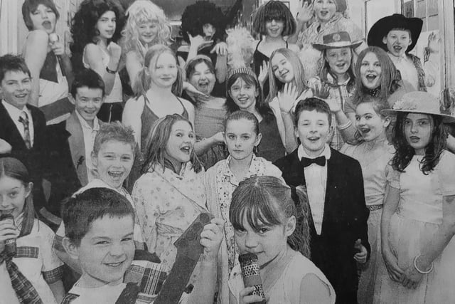 Dunearn Primary School marked its 50th anniversary with some special celebrations, including a trip back through the decades.
Dean Smart and Nicola Douglas appeared as the Bay City Rollers with the rest of the cast also pictured.