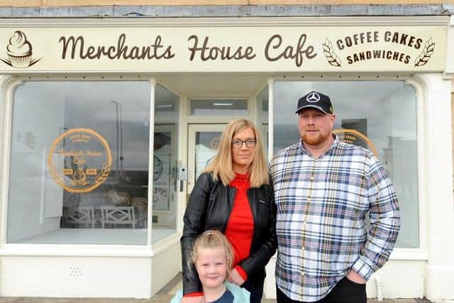 Ricky Barclay with his wife Marzena and daughter Hanna. Ricky and Marzena opened the Merchants House Cafe a year ago this weekend. Pic: Fife Photo Agency.