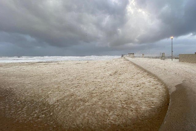The sea foam rolls in at Roker Beach.