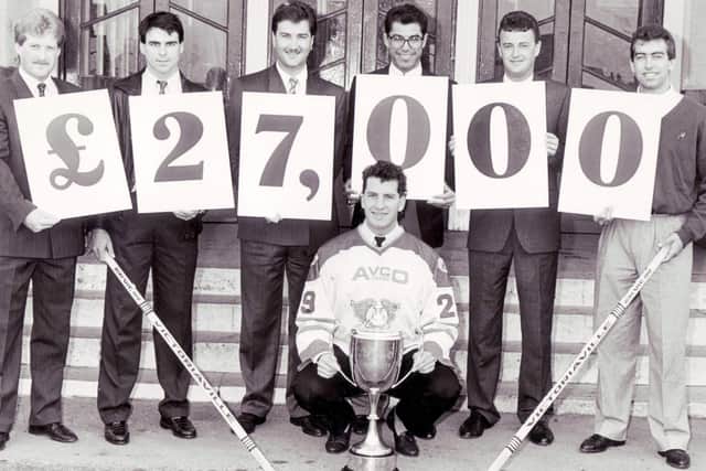 Fife Flyers launch new fundraising initiative circa  1991-92 - in front is team captain Cal Brown.  Left is Brian Kanewischer) coach, far right is Richard Laplante, third from right is Bob Korol (rink manager)