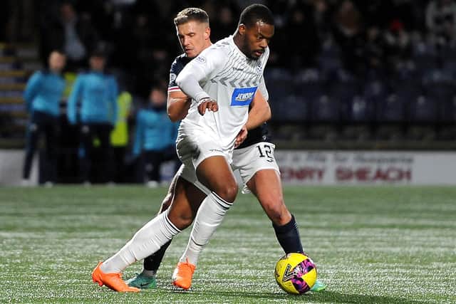 Ayr United's Dipo Akenyemi being tackled by Raith Rovers' Tom Lang (Pic: Fife Photo Agency)