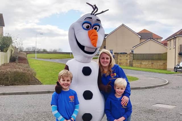 Olaf with Jennifer Gill, Micah and Rory.