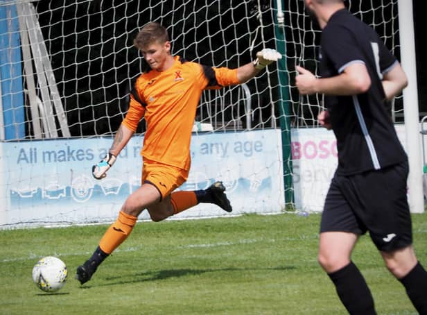 United keeper Kyle Moran sends a long ball forward. Picture by Blair Smith