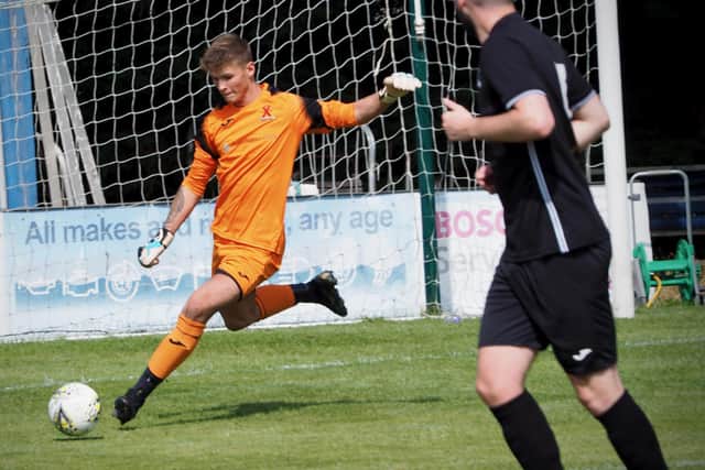 United keeper Kyle Moran sends a long ball forward. Picture by Blair Smith