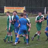 Thornton Hibs players (in green) jostle with their St Andrews United opponents