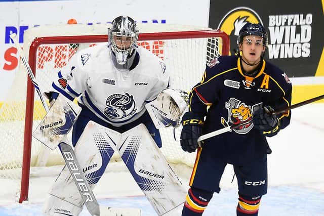 Ben Hawerchuk #16 of the Barrie Colts gets in front of goalie Jacob Ingham #1 of the Mississauga Steelheads during OHL game action (Photo by Graig Abel/Getty Images)