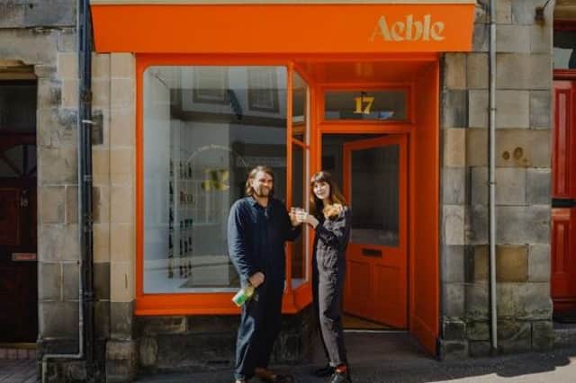 Grant and Jaye outside their new shop.