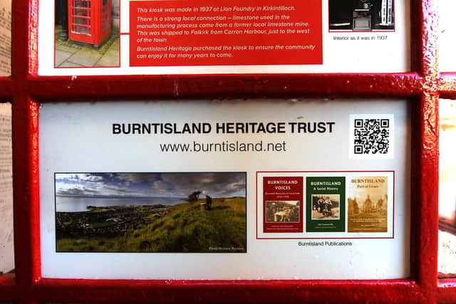 As well as a timeline of the town's history the frames on the red phone kiosk also feature information about Burntisland Heritage Trust. Pic: Fife Photo Agency.