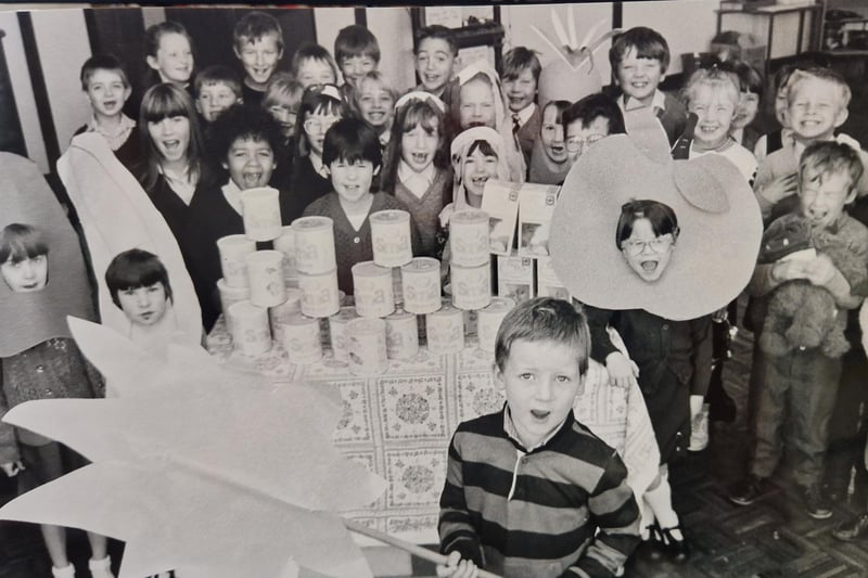 Young pupils from Warout Primary School in Glenrothes with a donation to a food appeal in 1988. Shaun Rafferty (6) is hoping the sun will shine in Jamaica to help the appeal. The photo was taken by David Cruickshanks, Glenrothes Gazette staff photographer.
