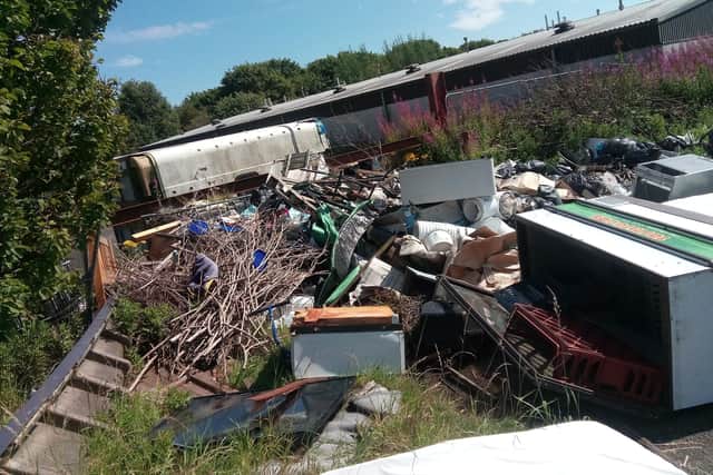 Commercial freezers are among the items dumped on the site of the former factory