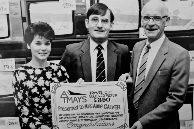 A presentation to a competition winner in December 1985. The picture features staff from AT Mays in the Kingdom Centre, Glenrothes, and the winner of the £250 voucher, Anne Carver. The prize was given away as part of AT Mays’ 21st birthday anniversary celebrations.