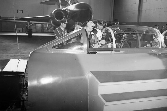 Queen Elizabeth visits the RAF at Leuchars and is seen watching the controls being operated by a pilot