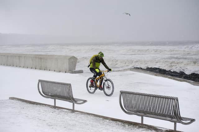 You know it's bad when the whiteout extends to the waterfront in Kirkcaldy.A brave cyclist takes a trip along the Prom in Kirkcaldy in February 2018.