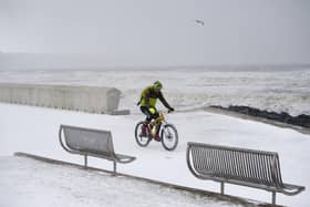 You know it's bad when the whiteout extends to the waterfront in Kirkcaldy.A brave cyclist takes a trip along the Prom in Kirkcaldy in February 2018.