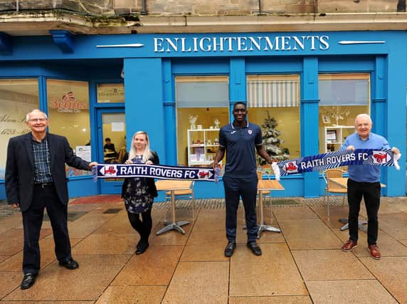 Iain Macdonald and Vicki Hutchison of Enlightenments with Raith's Fernandy Mendy and Tom Morgan (Pic: Fife Photo Agency)